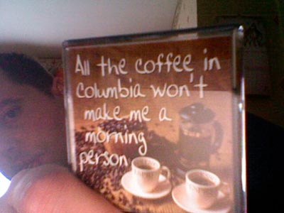 Photo of a fridge magnet that reads: All the coffee in Columbia won't make me a morning person