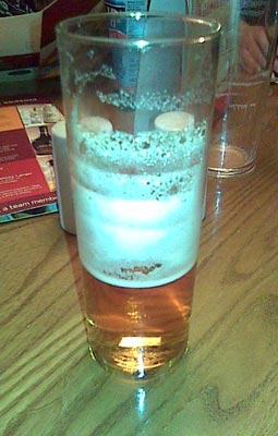A glass of Pimms and lemonade, no ice